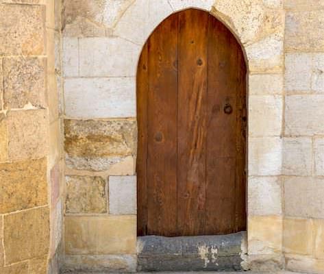 Vaulted door on exterior stone bricks wall of Amir Aqsunqur Mosque (Blue Mosque)